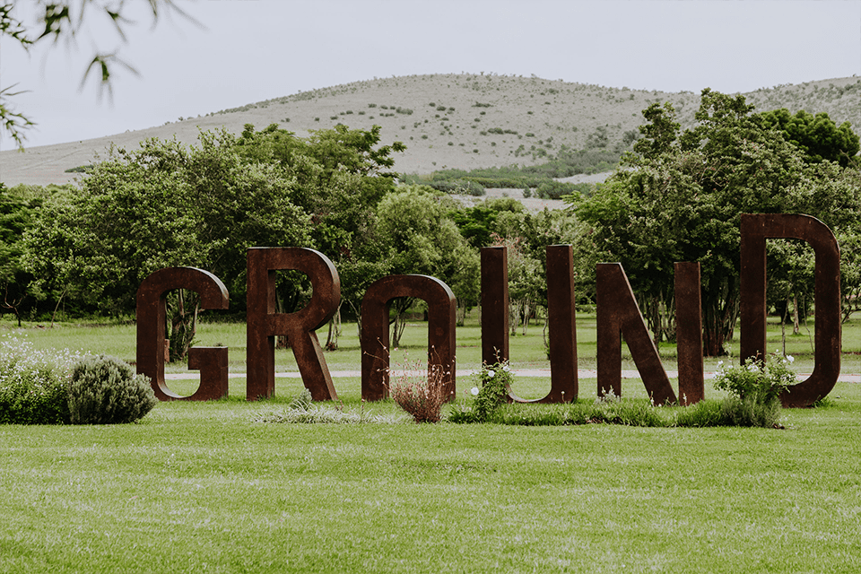 Ground The Venue with a big sign on the grass. Dog-friendly Hiking Trails in Gauteng. Pets24