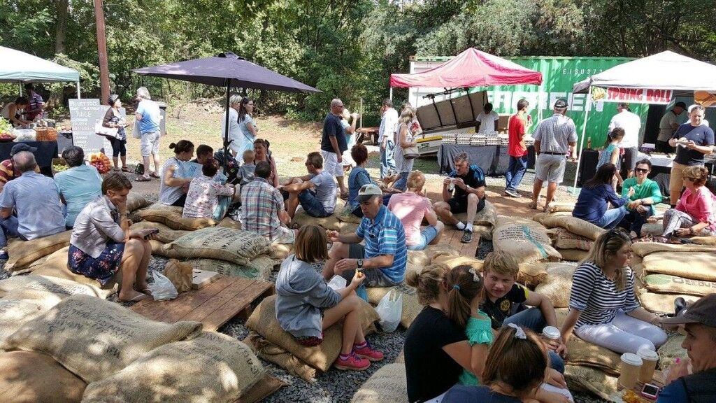 People sitting and walking around Irene Village Market pet-friendly things to do in Pretoria