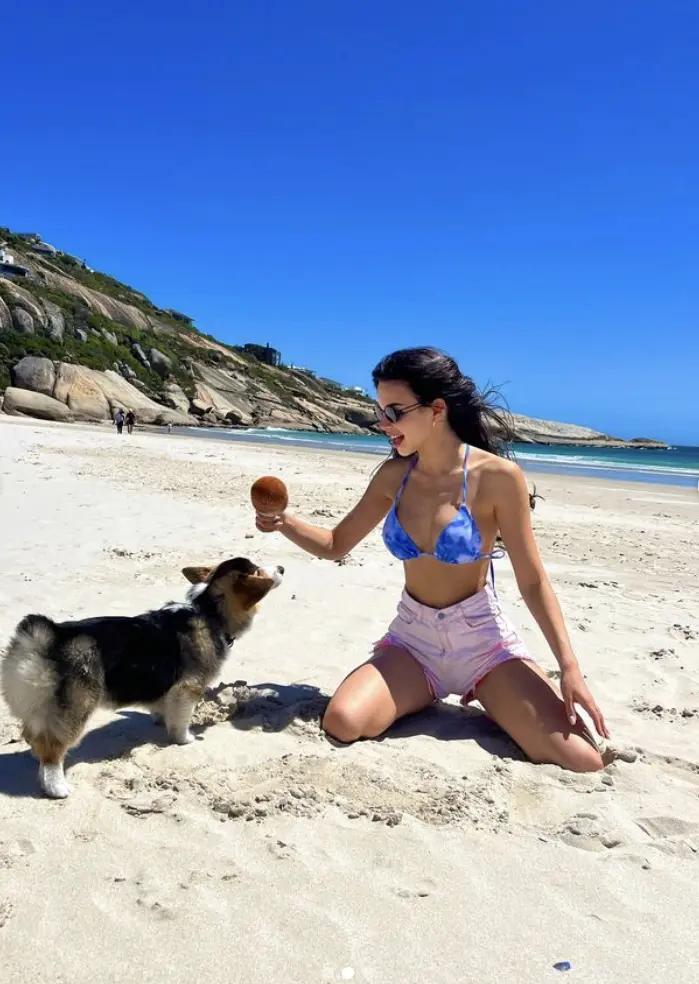 Olivia at the beach playing with her dog. Pet Influencers SA. Pets24
