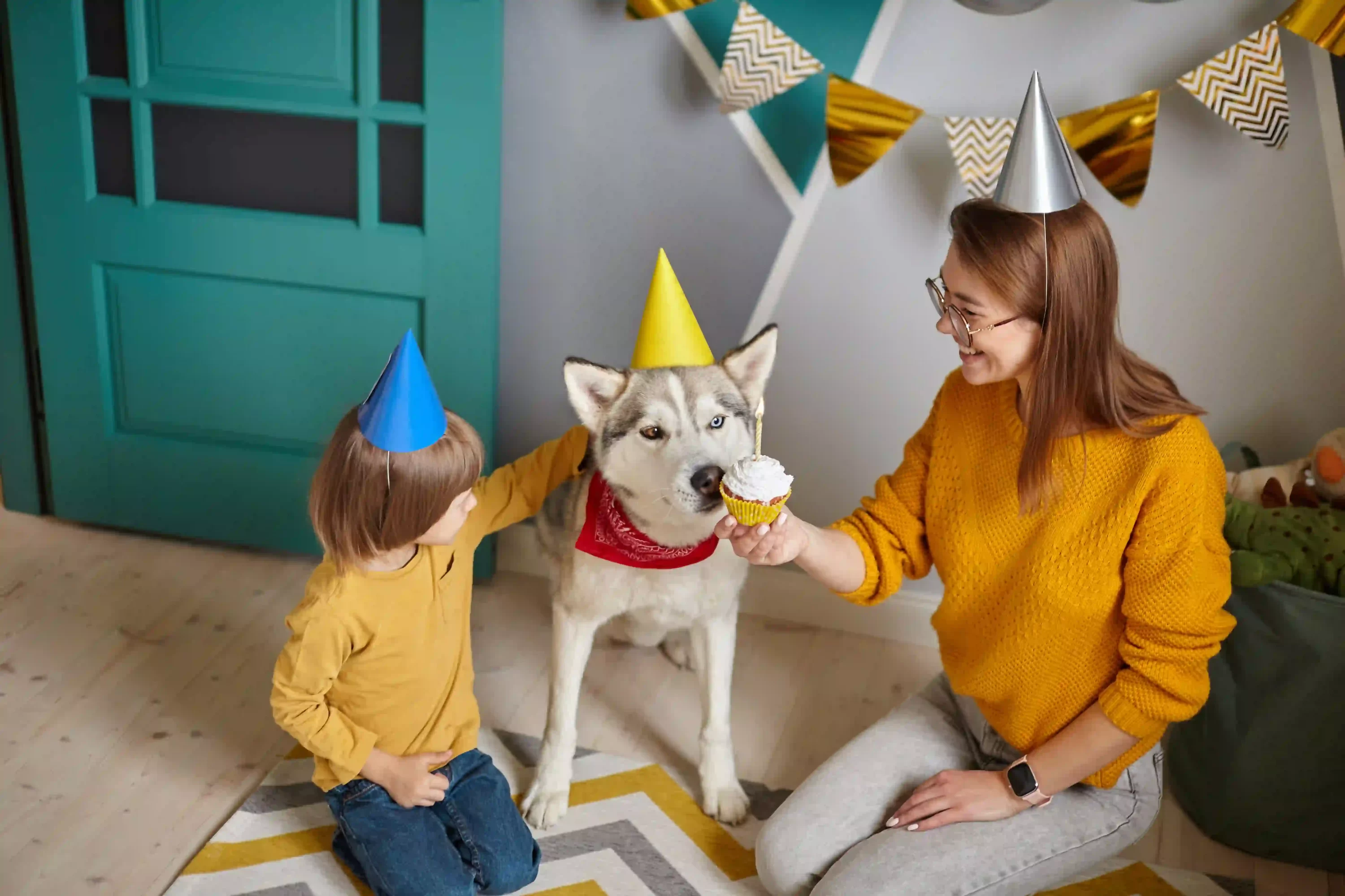 Woman and child with dog at dog party. dog party ideas