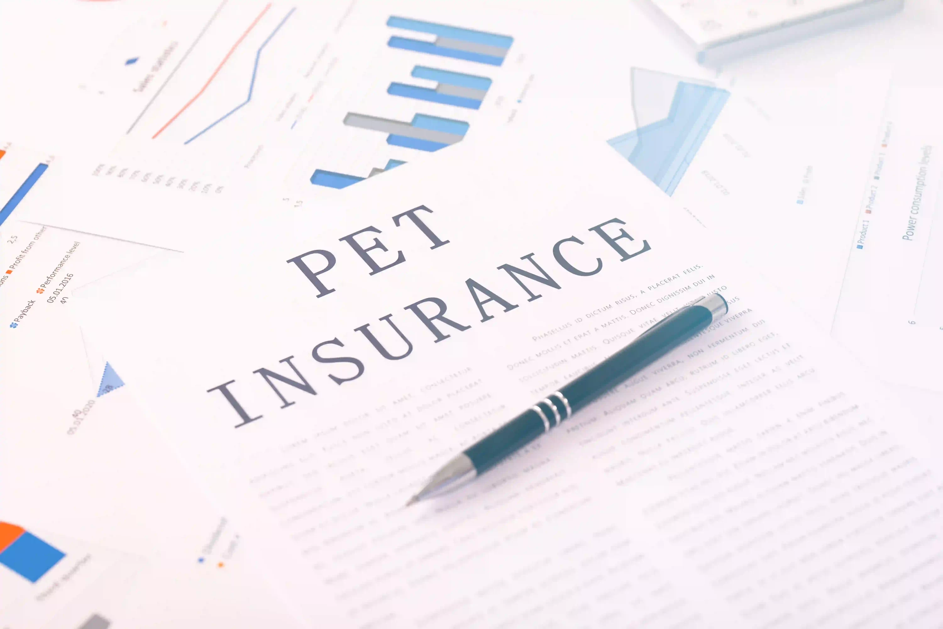Pen on insurance papers. Pet insurance for healthy pets