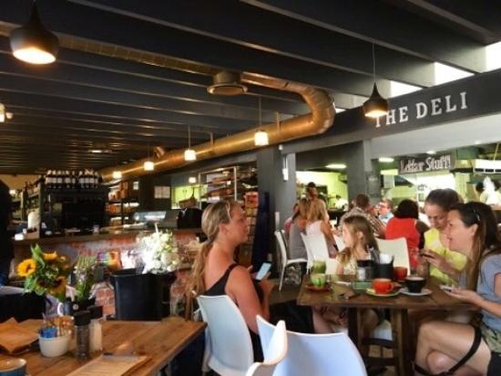 People dining at The Foodbarn Deli Shop restaurant. Pets24. Pet-friendly restaurants Cape Town